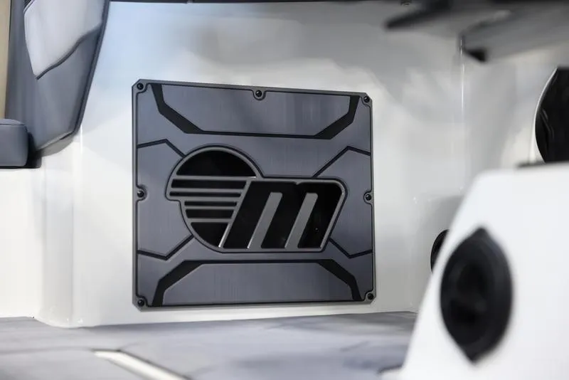 Slide: The Image of 2024 Malibu 23 MXZ boat interior detail with logo. - 15