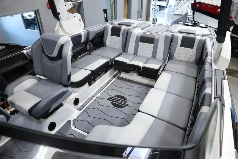 Slide: The Image of 2024 Malibu 23 MXZ boat interior with spacious seating and modern design. - 3