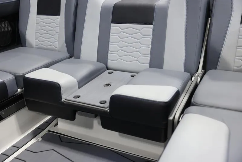 Slide: The Image of 2024 Malibu 23 MXZ boat interior seating with modern design and premium upholstery. - 8