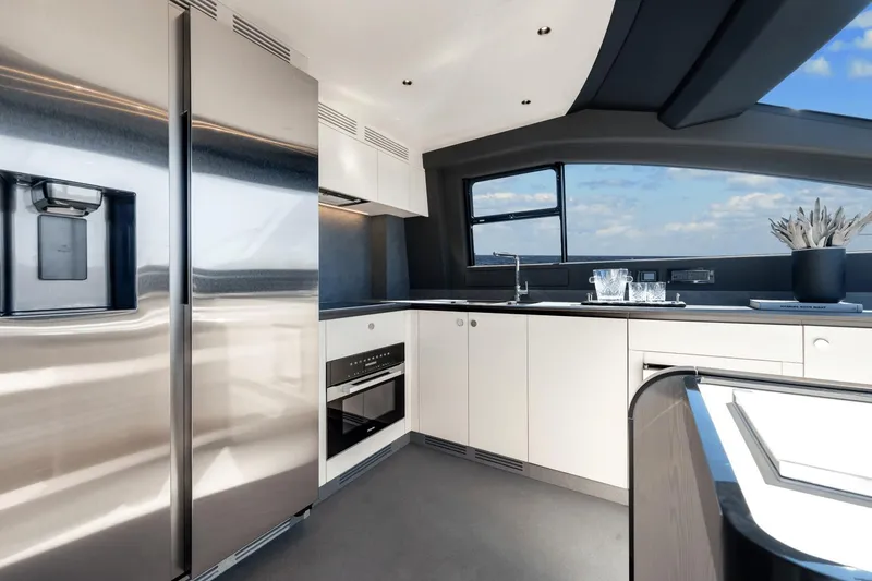 Slide: The Image of Modern kitchen interior on the 2024 Azimut Fly 78 yacht with stainless steel appliances. - 43