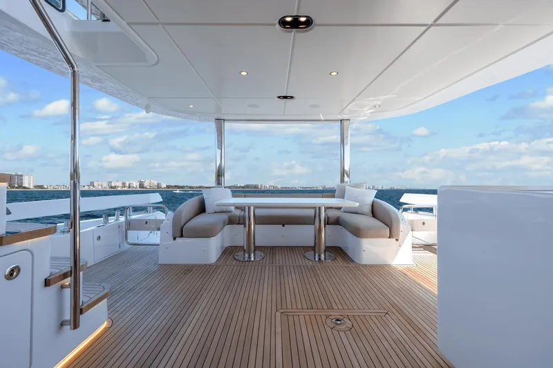 Slide: The Image of 2024 Azimut Fly 78 yacht deck with seating area and ocean view. - 47