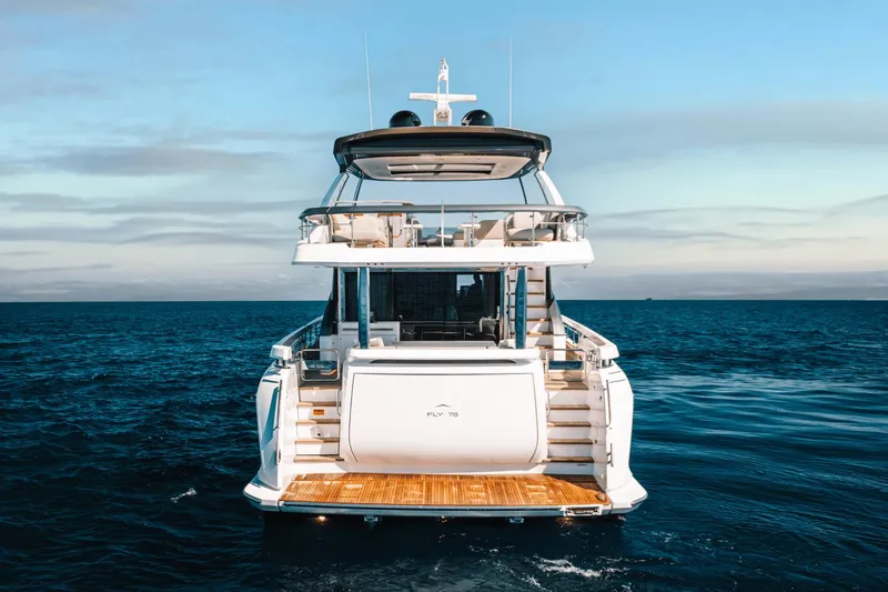 Slide: The Image of 2024 Azimut Fly 78 luxury yacht on open sea, rear view. - 9
