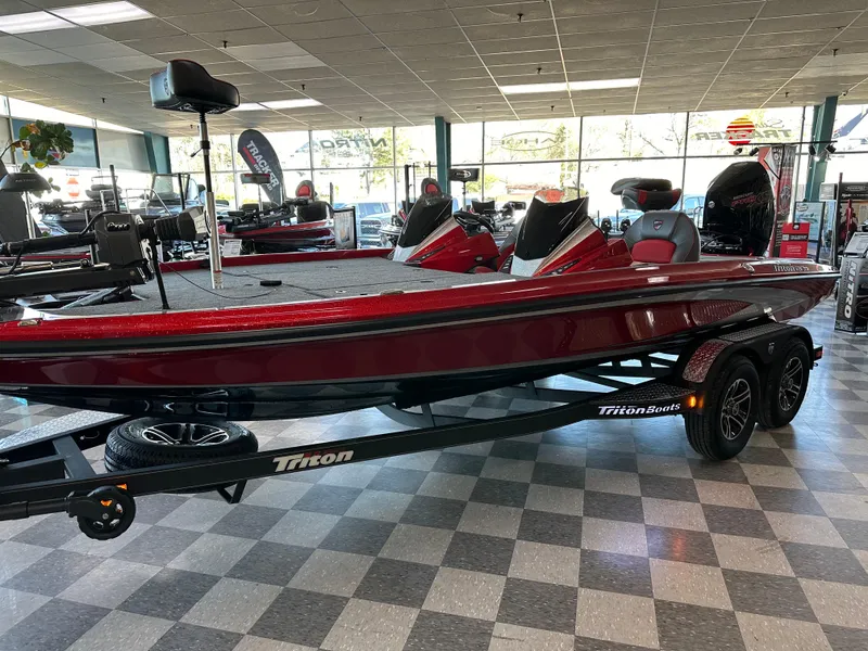 Slide: The Image of 2024 Triton 20XP Patriot bass boat in showroom, red color, on trailer. - 10
