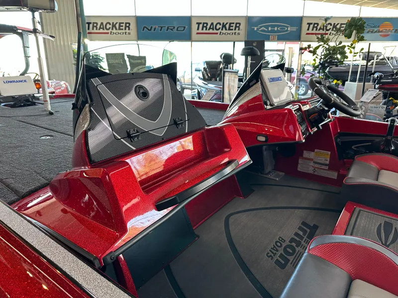 Slide: The Image of 2024 Triton 20XP Patriot boat interior with red accents and advanced dashboard. - 11