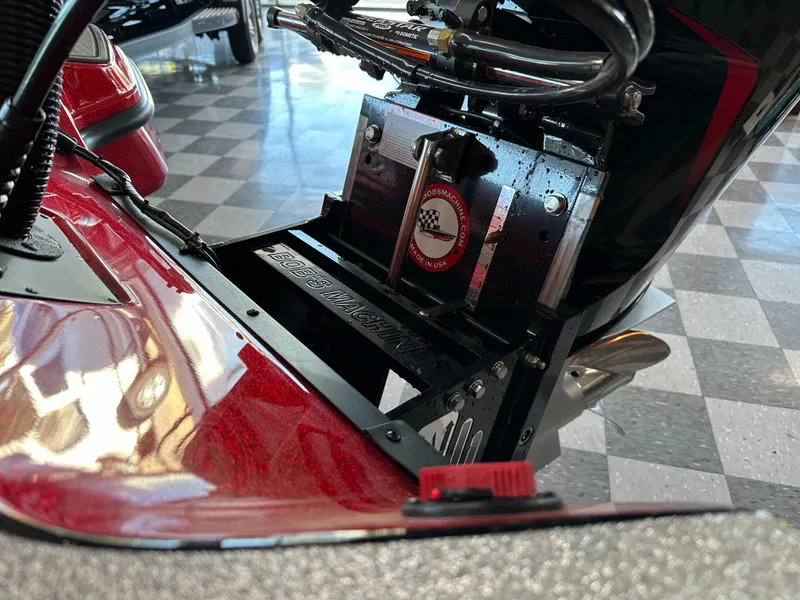 Slide: The Image of Close-up of 2024 Triton 20XP Patriot boat's motor mount in showroom. - 12