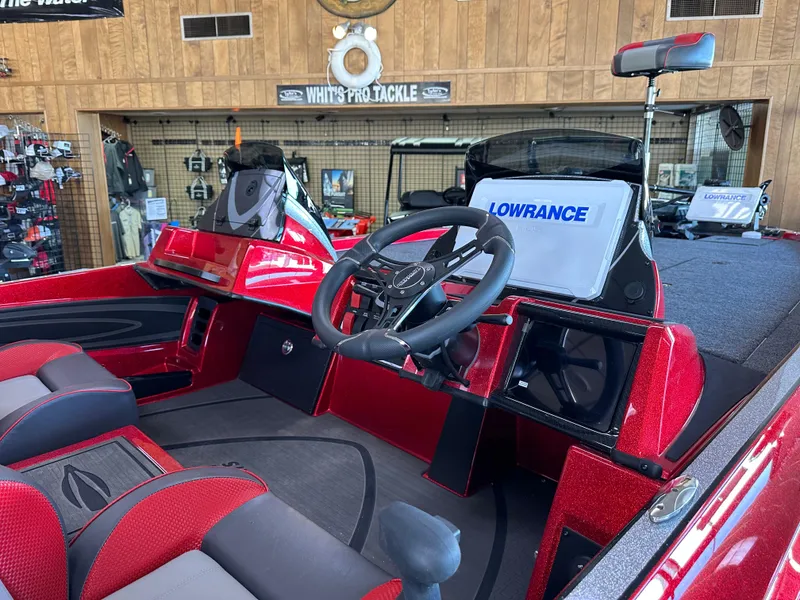 Slide: The Image of 2024 Triton 20XP Patriot boat interior with Lowrance electronics and red accents. - 7
