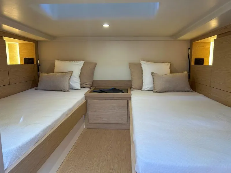 Slide: The Image of Interior cabin of 2024 Solaris Power 40 Open with twin beds and modern design. - 11