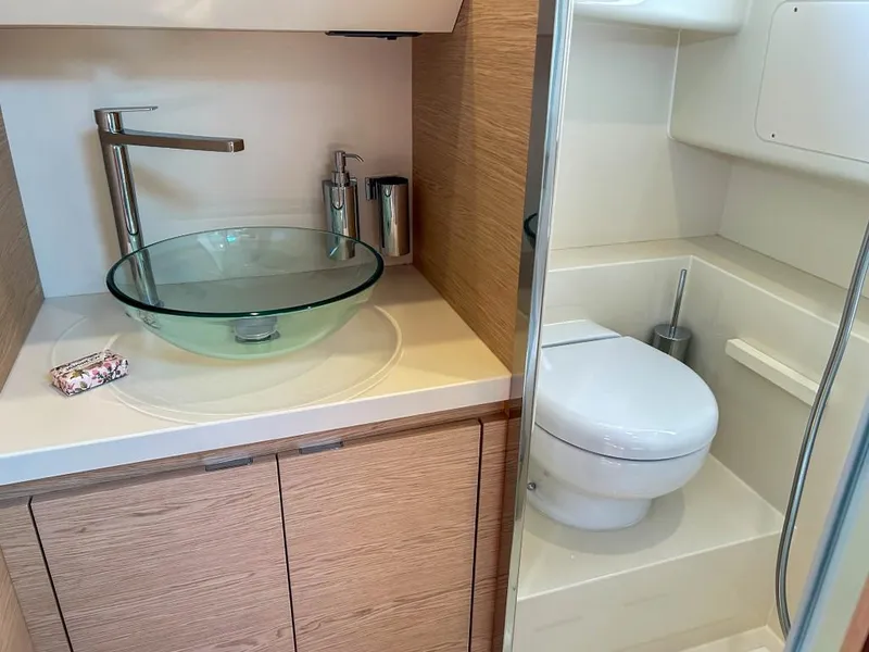 Slide: The Image of Modern bathroom in 2024 Solaris Power 40 Open yacht with glass sink and toilet. - 13