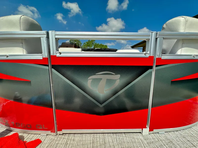 Slide: The Image of 2023 Tahoe Pontoon SLT Quad Lounge, red and black exterior, close-up view. - 13