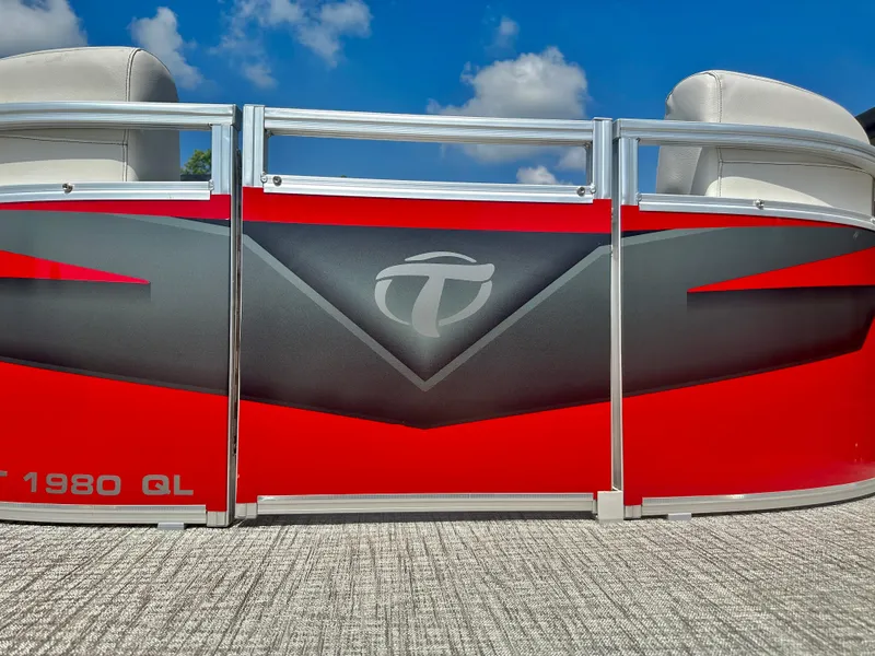 Slide: The Image of 2023 Tahoe Pontoon SLT Quad Lounge, red and black exterior, close-up view. - 5