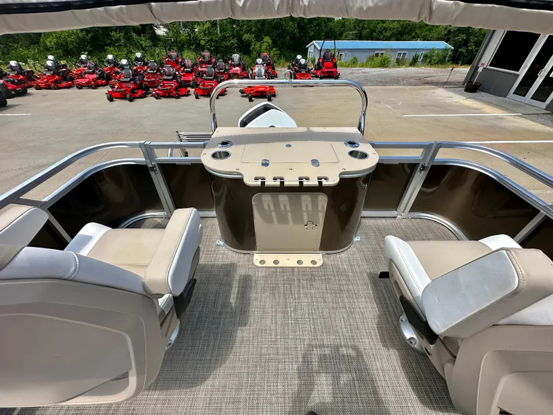 Slide: The Image of 2023 Tahoe Pontoon LTZ Rear Fish boat interior with fishing seats and control console. - 20