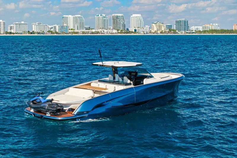 Slide: The Image of 2024 Solaris Power 44 Open yacht cruising near a city skyline on a sunny day. - 1