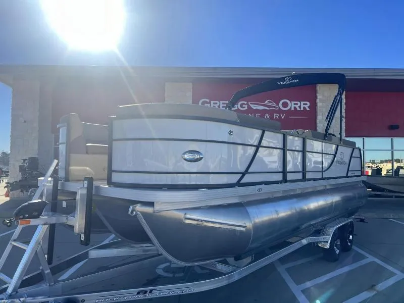 Slide: The Image of 2024 Veranda VR22VLB pontoon boat on trailer at dealership. - 1