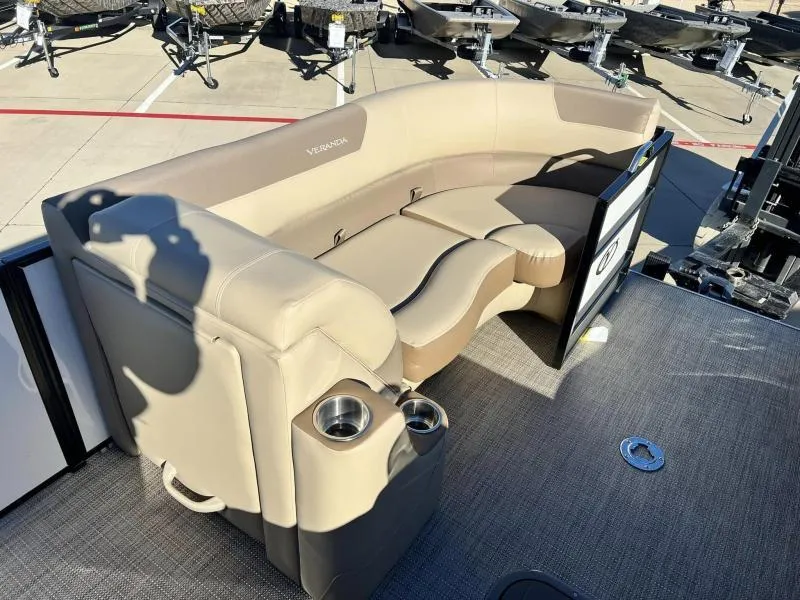 Slide: The Image of 2024 Veranda VR22VLB pontoon boat with beige seating and cup holders. - 11