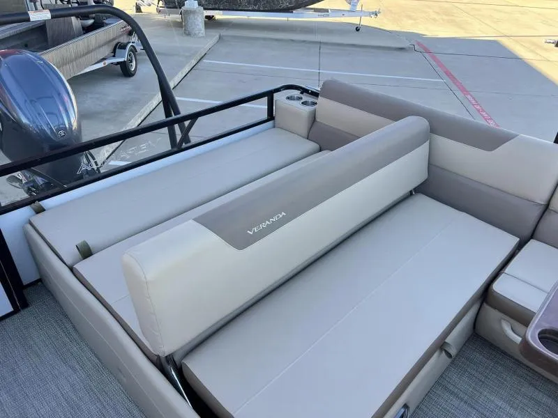 Slide: The Image of 2024 Veranda VR22VLB pontoon boat with luxurious seating and cup holders. - 7