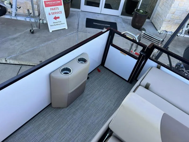 Slide: The Image of Interior of 2024 Veranda VR22VLB pontoon boat with cup holders and seating. - 8