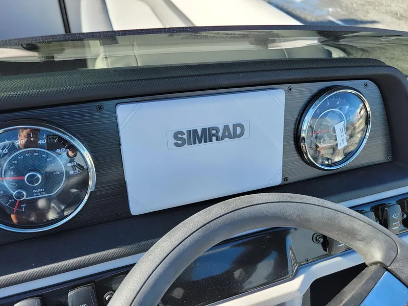 Slide: The Image of 2024 Godfrey SWEETWATER 2286 SFL dashboard with Simrad display and gauges. - 14