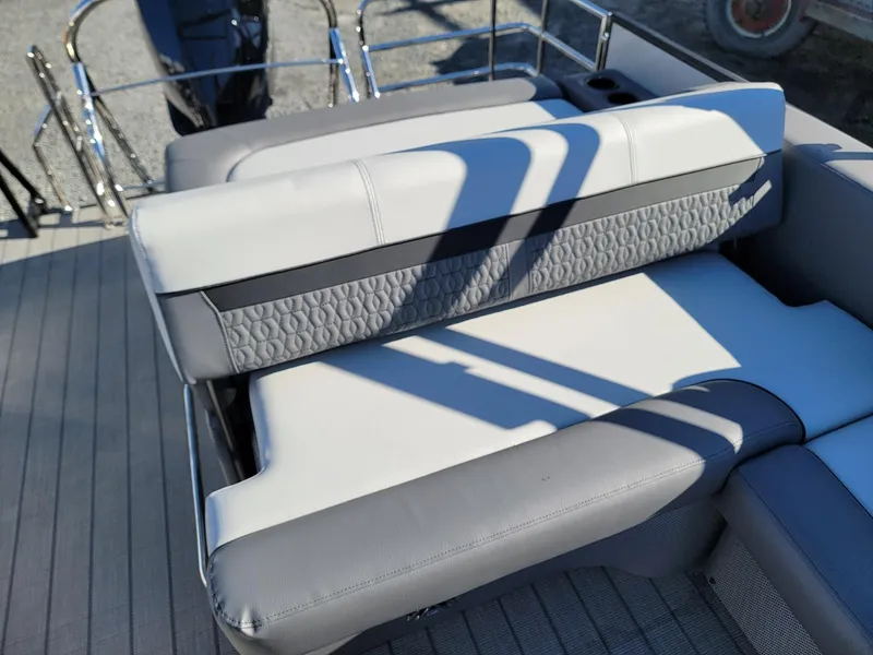 Slide: The Image of 2024 Godfrey SWEETWATER 2286 SFL boat seating area with gray and white upholstery. - 20