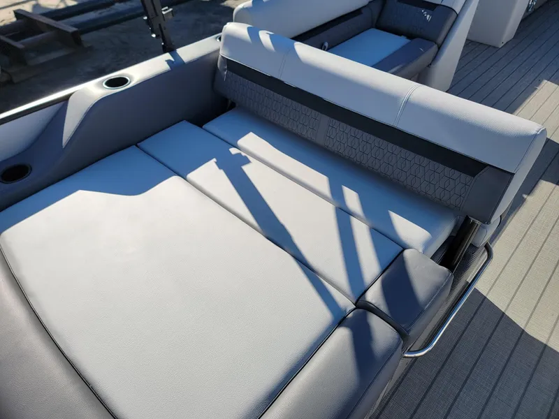 Slide: The Image of 2024 Godfrey SWEETWATER 2286 SFL boat interior seating area. - 23