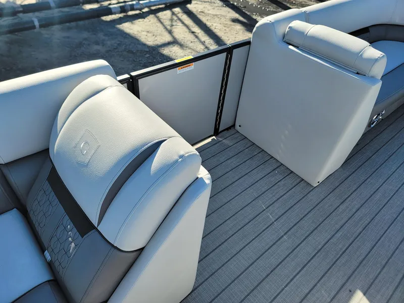 Slide: The Image of 2024 Godfrey SWEETWATER 2286 SFL boat interior with gray seating and flooring. - 27