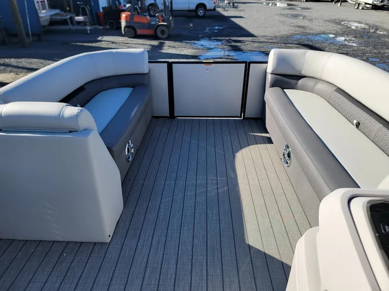 Slide: The Image of 2024 Godfrey SWEETWATER 2286 SFL pontoon boat interior with spacious seating. - 28