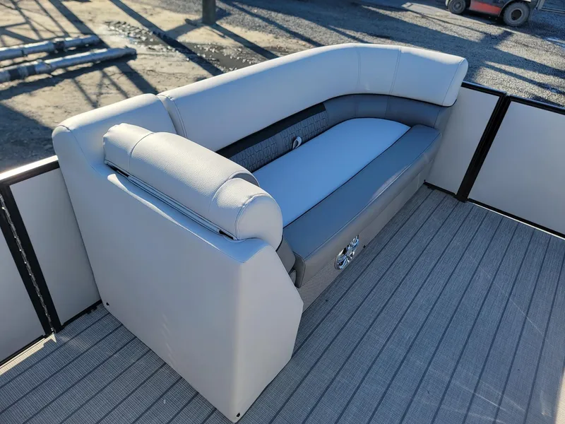 Slide: The Image of 2024 Godfrey SWEETWATER 2286 SFL boat seating area with cushioned bench. - 30