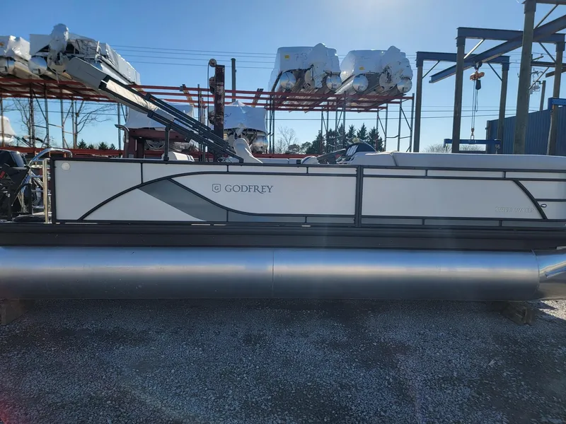 Slide: The Image of 2024 Godfrey SWEETWATER 2286 SFL pontoon boat in storage yard. - 5