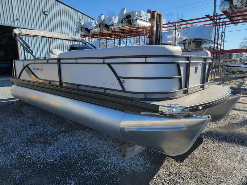 Slide: The Image of 2024 Godfrey SWEETWATER 2286 SFL pontoon boat in a storage yard. - 6