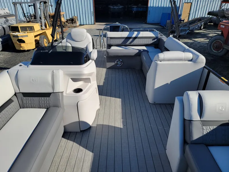Slide: The Image of 2024 Godfrey SWEETWATER 2286 SFL pontoon boat interior with luxurious seating and helm station. - 8
