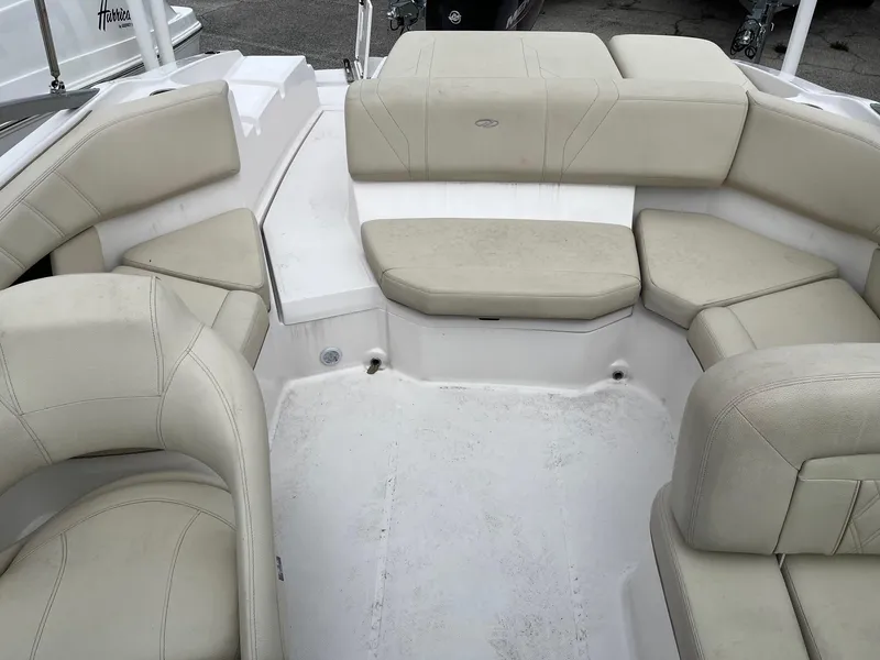 Slide: The Image of 2019 Regal 21 OBX boat with spacious beige seating area. - 8