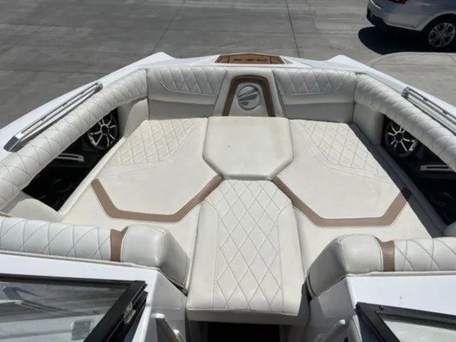 Slide: The Image of Luxurious interior of 2019 Tigé RZX2 boat with white quilted seating. - 25