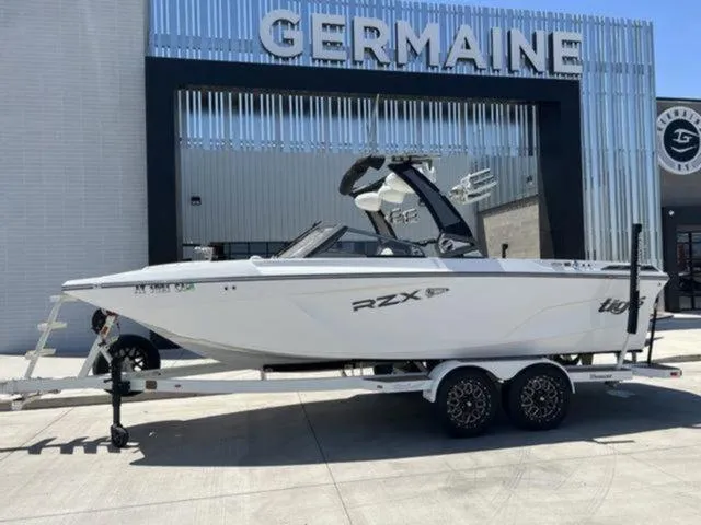 Slide: The Image of 2019 Tigé RZX2 boat on trailer outside Germaine dealership. - 33