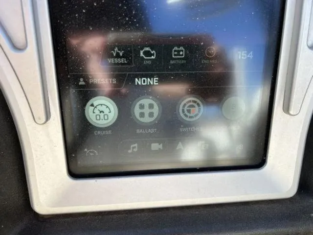 Slide: The Image of Touchscreen display of a 2019 Tigé RZX2 boat showing cruise, ballast, and switch controls. - 48