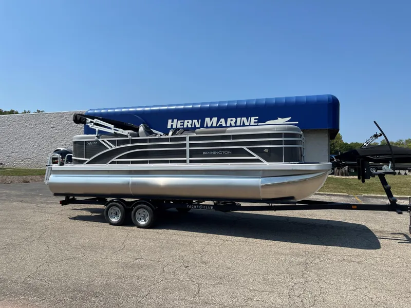 The Image of 2024 Bennington SV Line pontoon boat on trailer at Hern Marine dealership. - 0