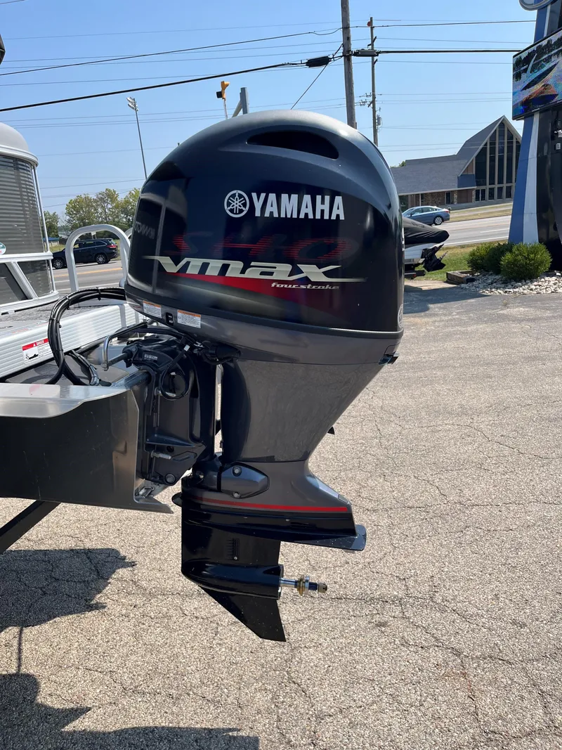 Slide: The Image of 2024 Bennington SV Line with Yamaha VMAX outboard motor in a sunny outdoor setting. - 12