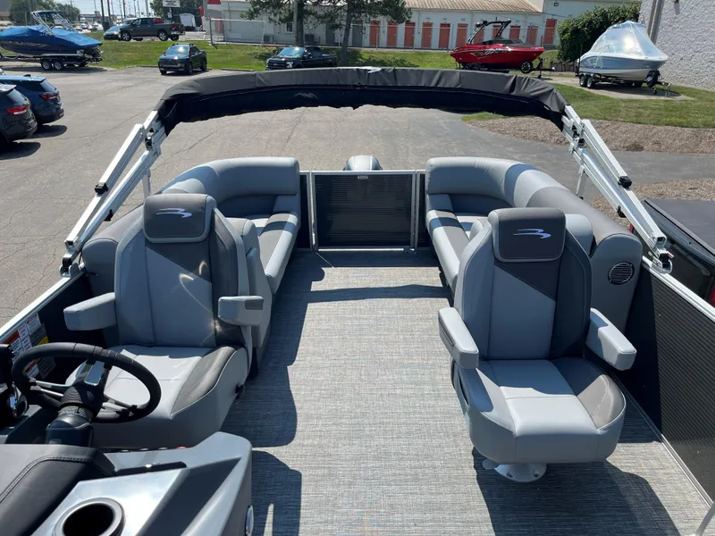 Slide: The Image of 2024 Bennington SV Line pontoon boat with gray seating and open deck layout. - 3