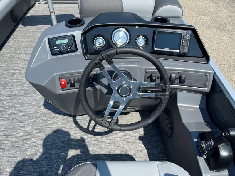 Slide: The Image of 2024 Bennington SV Line boat dashboard with steering wheel and control panel. - 5