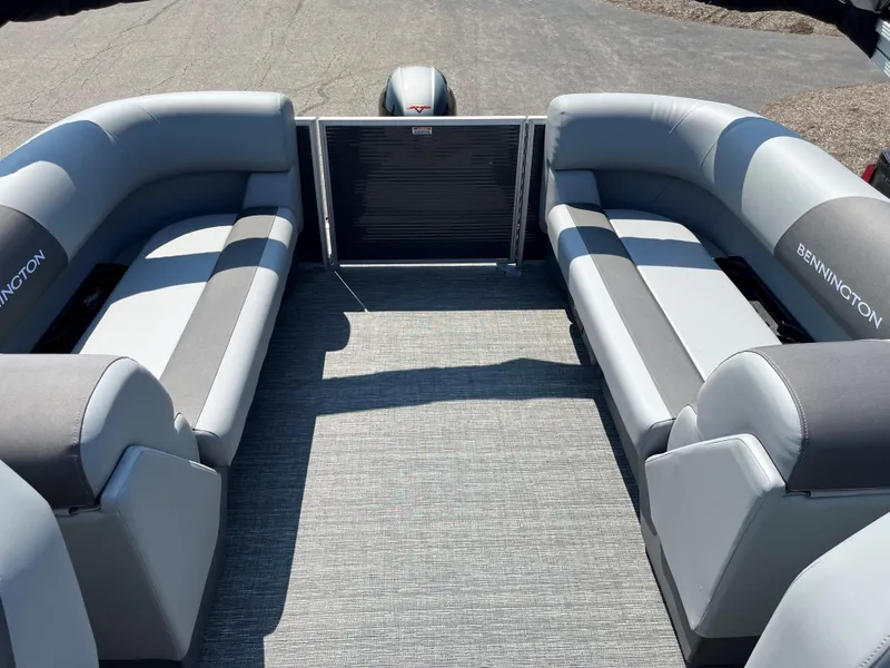 Slide: The Image of 2024 Bennington SV Line pontoon boat interior with gray seating and carpet flooring. - 8