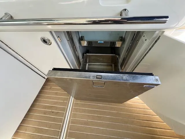 Slide: The Image of Open drawer on 2010 Sea Ray 450 Sundancer yacht, showcasing storage space. - 11