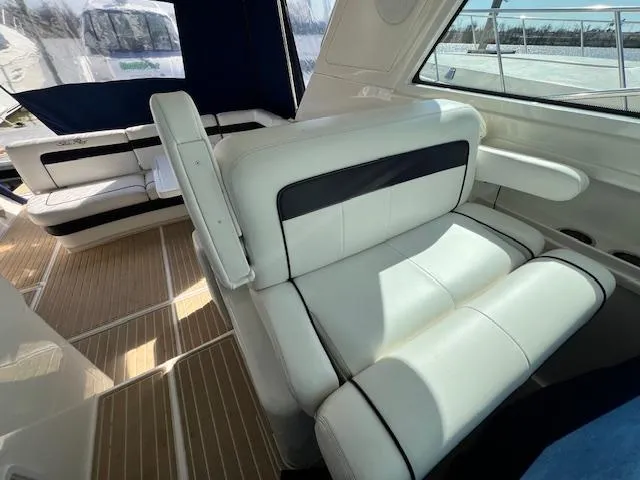 Slide: The Image of Interior seating of 2010 Sea Ray 450 Sundancer yacht with white and black upholstery. - 13
