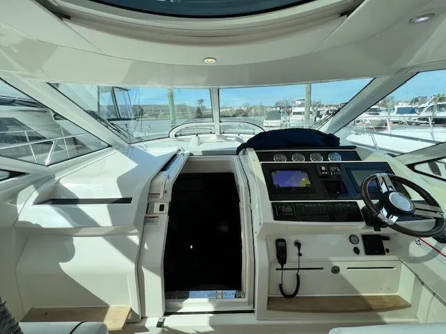 Slide: The Image of Interior helm of 2010 Sea Ray 450 Sundancer yacht with modern navigation equipment. - 16