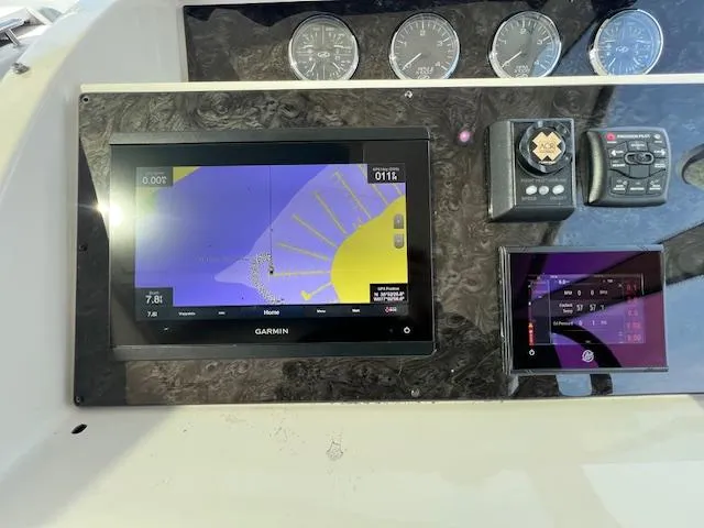 Slide: The Image of Garmin navigation system on 2010 Sea Ray 450 Sundancer dashboard. - 18