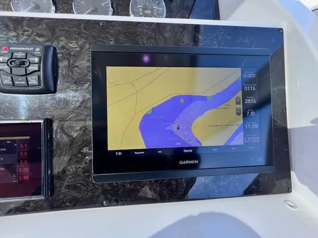 Slide: The Image of Garmin navigation display on 2010 Sea Ray 450 Sundancer yacht dashboard. - 19