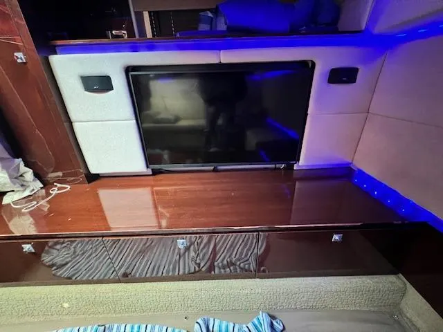 Slide: The Image of Interior of 2010 Sea Ray 450 Sundancer with TV and blue LED lighting. - 25