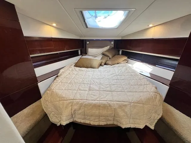 Slide: The Image of Luxurious bedroom interior of 2010 Sea Ray 450 Sundancer yacht with skylight. - 29