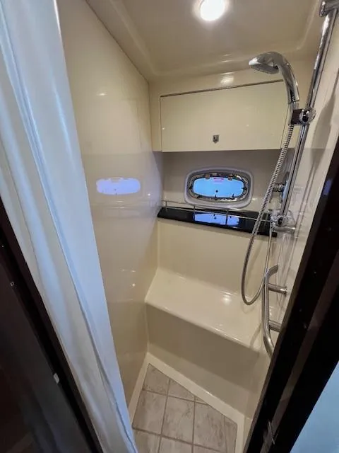 Slide: The Image of 2010 Sea Ray 450 Sundancer shower with window and modern fixtures. - 31