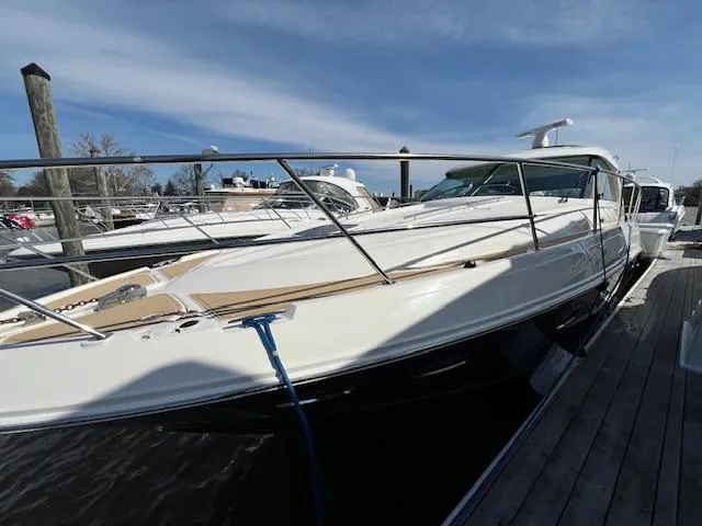 Slide: The Image of 2010 Sea Ray 450 Sundancer yacht docked at marina on a sunny day. - 4