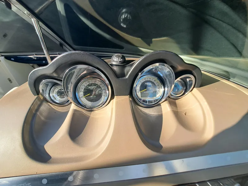 Slide: The Image of Close-up of 2010 Sea Ray 260 Sun Deck boat dashboard gauges. - 10