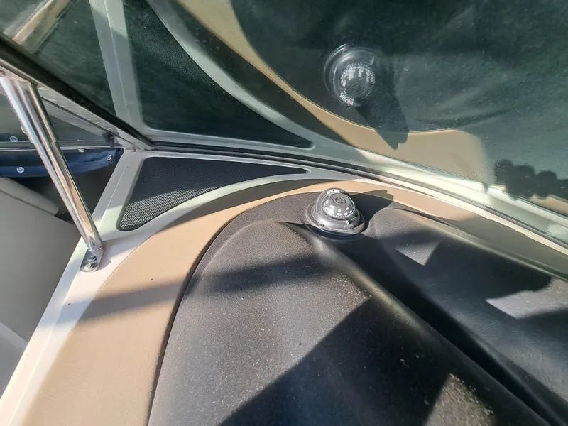 Slide: The Image of Close-up of the 2010 Sea Ray 260 Sun Deck windshield and dashboard. - 13