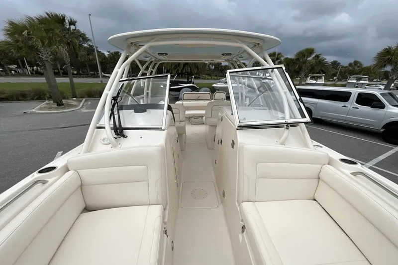 Slide: The Image of 2023 Grady-White Freedom 275 boat interior with spacious seating and open deck design. - 13